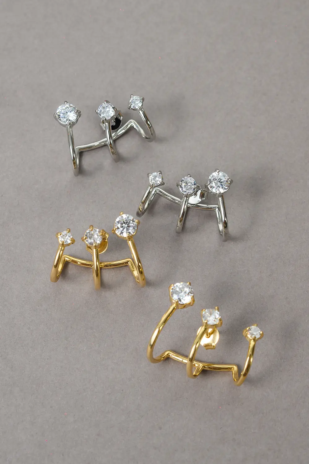 Brinco Ear Cuff Ponto de Luz com Banho em Ródio Branco